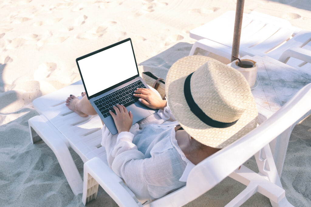 A digital nomad working on a laptop with a view of Istanbul, reflecting the legal considerations of remote work in Turkey, advised by a Turkish lawyer.